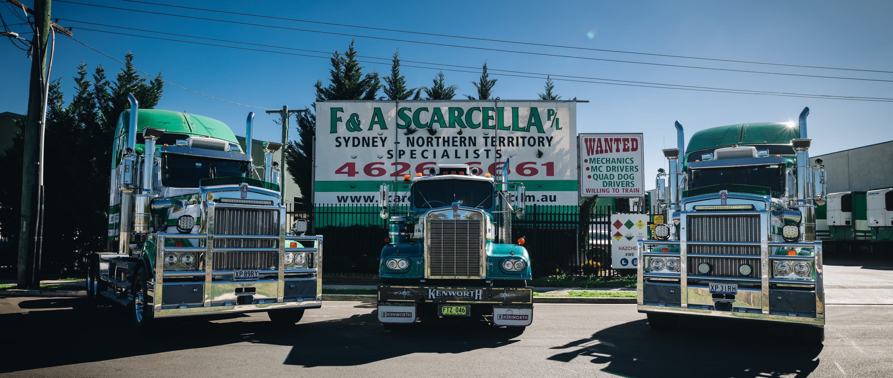 Three Scarcella Kenworth prime movers parked in front of the F & A Scarcella depot sign