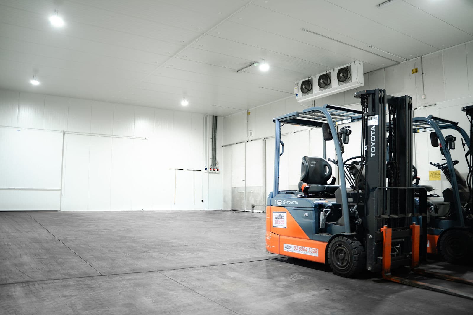 Forklifts inside the refrigerated cold store at the Darwin depot