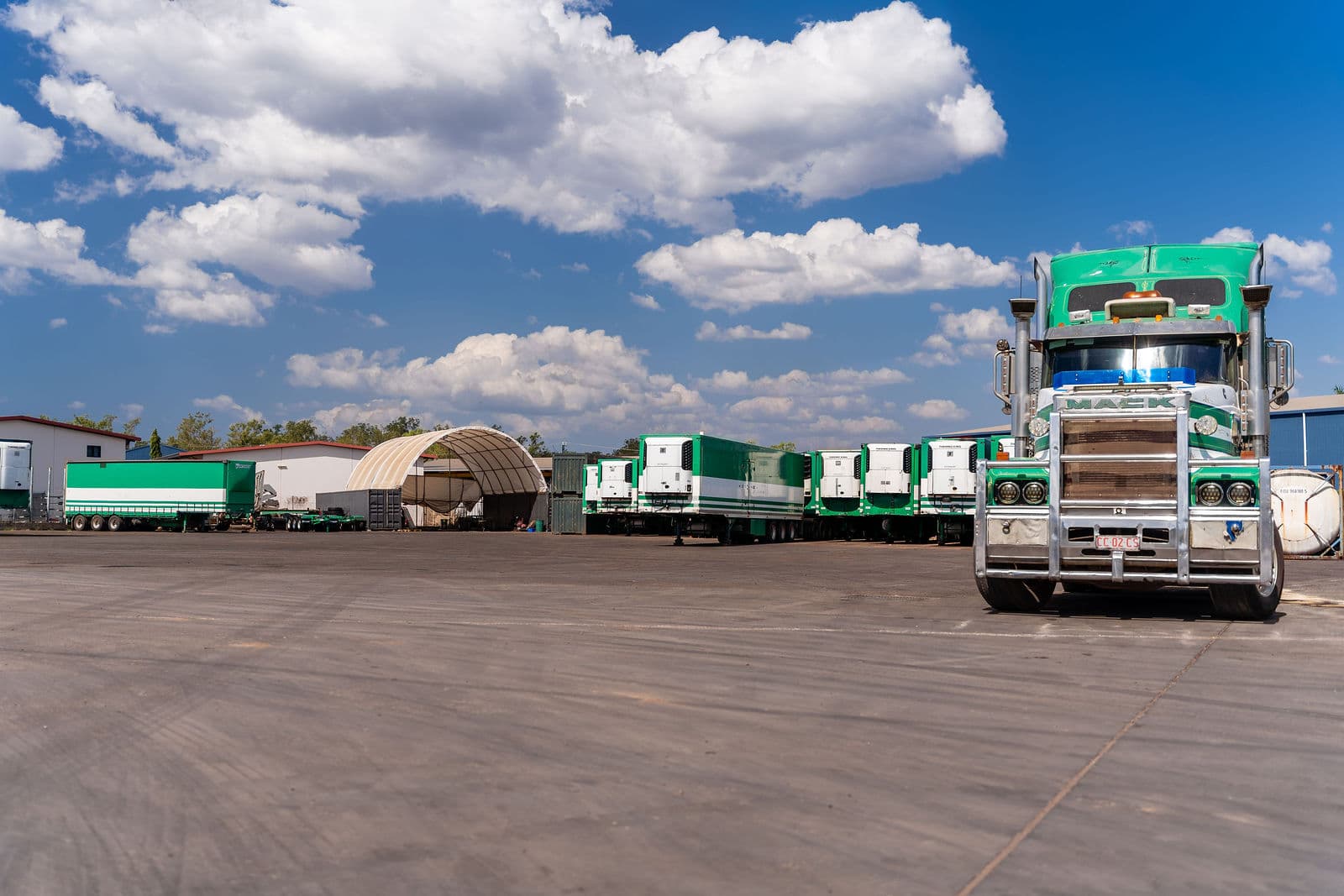 A Scarcella Mack prime mover and refrigerated trailers lined up in the Darwin yard