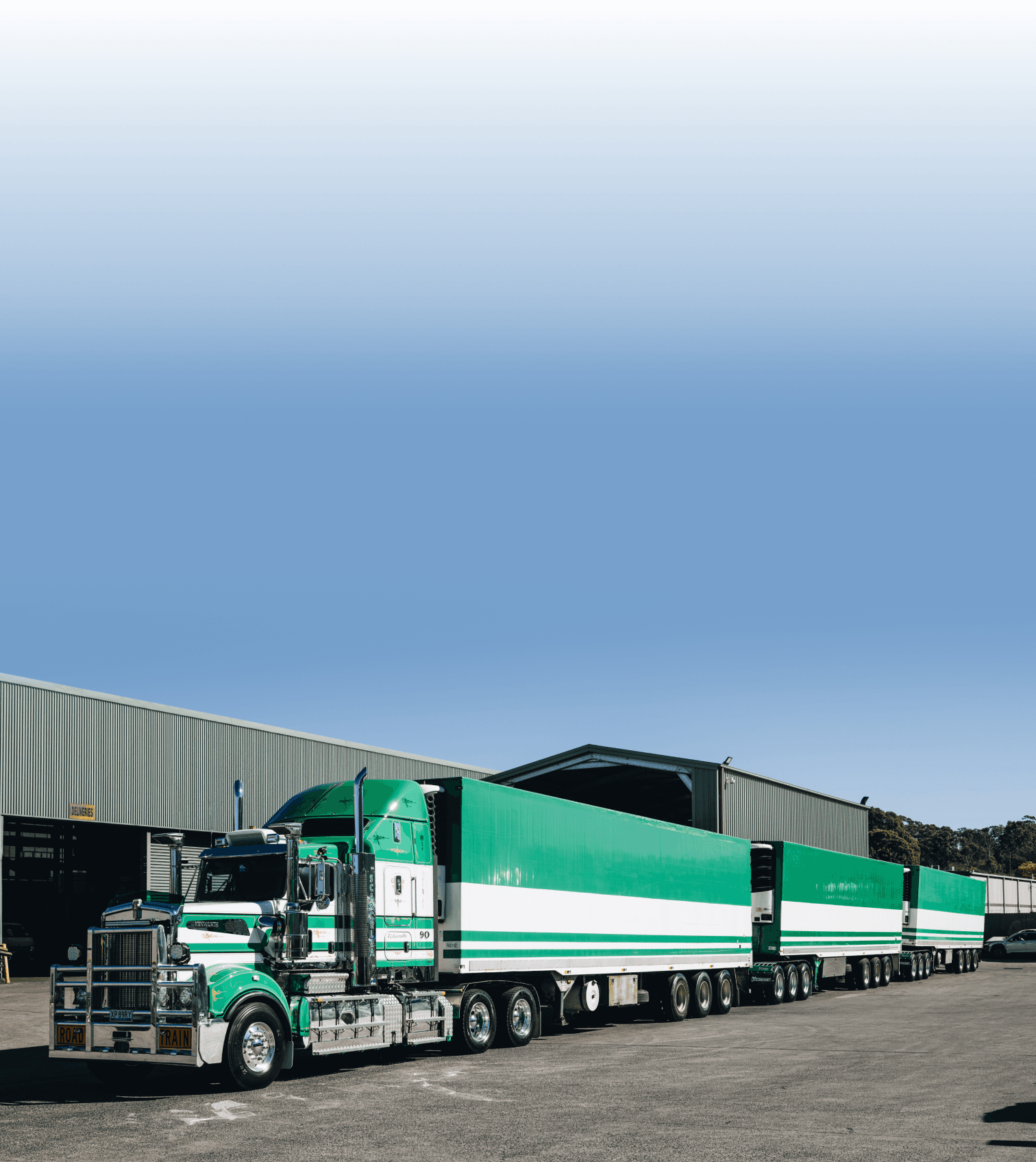 Scarcella road train loaded at the depot under a clear sky